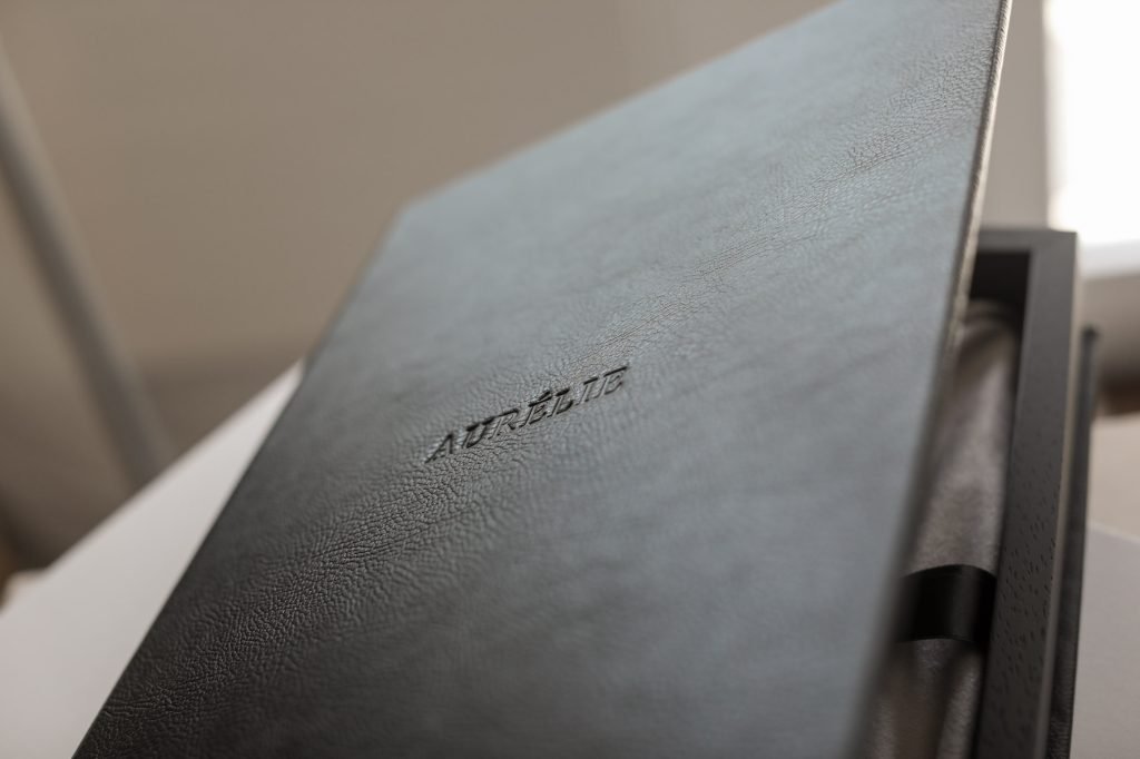 Detail on black leather photo book from boudoir session