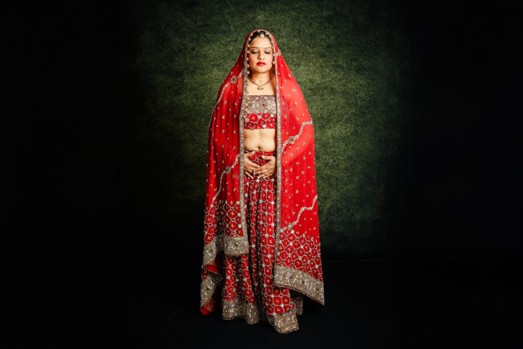 Image of woman wearing her red traditional Indian wedding dress